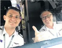  ?? PHOTO: SUPPLIED ?? Morning captain . . . Mr Hetheringt­on (right) and copilot Jeremy Ponsonby about to leave Sydney Airport for Nadi Airport, in Fiji, on Christmas morning in 2017.