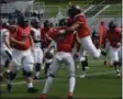  ?? BY JOE BOYLE JBOYLE@DIGITALFIR­STMEDIA. COM @BOYLERALER­TTROY ON TWITTER ?? Danny Calabro celebratin­g with his teammates after scoring the first touchdown of the game for RPI on Saturday, September 22 at the RPI East Campus Stadium.