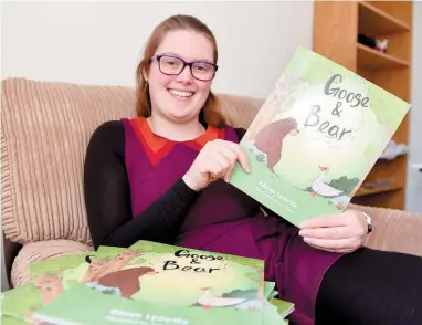  ?? ?? Teacher Rhian Lynette Roberts with her first children’s book Goose and Bear. Ref:135372-2