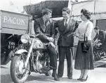  ??  ?? John Surtees (left) chats to some bloke about his Norton Dominator 88…