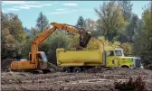  ?? Union Democrat/ Shellythor­ene ?? Boulders are loaded into a dump truck Thursday at the Stone Mill Center project site near Columbia.