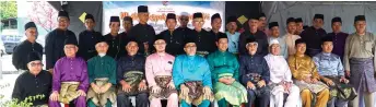  ??  ?? Dr RAbdul Rahman (seated seventh left), flanked by Hasbi (on his right) and Abu Bakar, at the Raya celebratio­n.