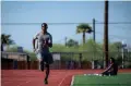  ?? MONICA D. SPENCER/THE REPUBLIC ?? Brian Fair Jr. runs on the South Mountain High School track in Phoenix during practice on Monday.