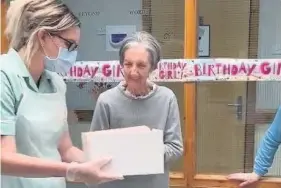  ??  ?? Special day Mary Mcmahon (known as May) enjoyed her special cake at Rawyards Nursing home Airdrie