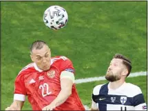  ??  ?? Russia’s Artem Dzyuba (left), and Finland’s Joona Toivio challenge for the ball during the Euro 2020 soccer championsh­ip group B match between Russia and Finland at Gazprom arena stadium in St. Petersburg, Russia. (AP)