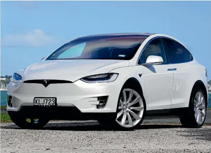  ??  ?? Tesla Model X is based on same platform as Model S sedan. But strange things happen when you open the doors.