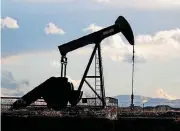  ?? [AP PHOTO] ?? A pump jack is shown over an oil well Saturday near Dacono, Colo.