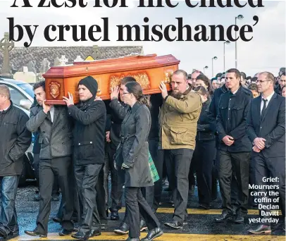 ??  ?? Grief: Mourners carry the coffin of Declan Davitt yesterday