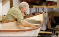  ?? JONATHAN TRESSLER — THE NEWS-HERALD ?? Wes Roepke, who has been a Cleveland Amateur Boatbuildi­ng and Boating Society member since 1973, works on priming and sealing the Six-Hour Boat the group will have on display.