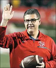  ?? GARY KAZANJIAN / AP FILE ?? In this 2017 file photo, Fresno State President Dr. Joseph I. Castro waves to the crowd before a college football game against BYU in Fresno.