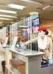  ??  ?? Protective barriers have been installed at each check-in desk.