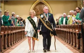  ?? COURTESY OF WILL PEEBLES ?? St. Patrick’s Day Parade Committee Grand Marshal George Schwarz III and his wife, Patricia Hodges Schwarz, enter the Cathedral Basilica of St. John the Baptist for St. Patrick’s Day Mass in Savannah.