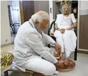  ?? — PTI ?? Prime Minister Narendra Modi takes blessings of his mother Heeraba on her 100th birthday at her residence in Gandhinaga­r on Saturday. “Maa... this isnt a mere word but it captures a range of emotions. Today, 18th June, is the day my Mother Heeraba enters her 100th year. On this special day, I have penned a few thoughts expressing joy and gratitude,” the Prime Minister posted on Twitter.