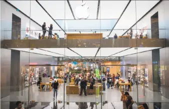  ?? Nicole Tung / Bloomberg ?? Customers visit the Apple store in an Istanbul mall. President Recep Tayyip Erdogan vowed to boycott iPhones in defiance of a U.S. demand that Turkey release an American pastor.