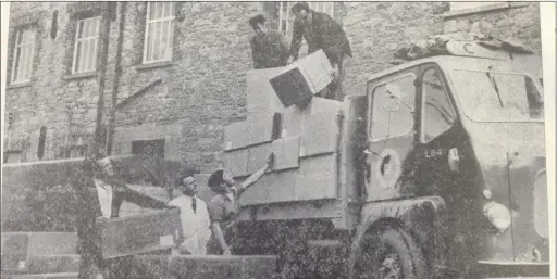  ??  ?? High fashion bootees being loaded at Edward Donaghy and Sons, bound for Montreal, Canada. Pictured loading are John Connor, Production Manager, Michael Leonard and Jim McDonnell and CIE lorry men Paddy Brennan and John Cole.(1967)