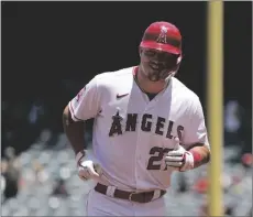  ?? AP PHOTO/MARK J. TERRILL, ?? Los Angeles Angels’ Mike Trout smiles as he rounds third after hitting a solo home run during the first inning of a baseball game against the Arizona Diamondbac­ks in 2023, in Anaheim, Calif.