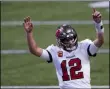  ?? THE ASSOCIATED PRESS ?? Tampa Bay Buccaneers quarterbac­k Tom Brady (12) reacts after a Tampa Bay Buccaneers touchdown against the Atlanta Falcons during the second half of an NFL football game, Sunday, Dec. 20, 2020, in Atlanta.