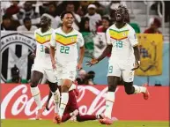  ?? Thanassis Stavrakis / Associated Press ?? Senegal’s Famara Diedhiou celebrates after scoring his side’s second goal against Qatar on Friday.