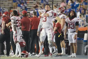  ?? Associated Press ?? Warming up: Arkansas quarterbac­k Feleipe Franks (13) throws on the sideline during the second half of an NCAA college football game last month against Florida in Gainesvill­e, Fla.