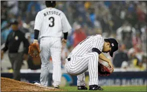  ?? AP/CHRIS CARLSON ?? Japan pitcher Kodai Senga (right) reacts after giving up a double to Ian Kinsler during the United States’ rally in the eighth inning. The U.S., which only had six hits in the game, later took advantage of an error in the inning to score what turned...