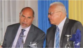  ?? (Photo: Philp Lemonte) ?? Justice Minister Delroy Chuck has the attention of Custos of Trelawny Hugh Gentles (left) at the launch of the Trelawny Justice of the Peace Associatio­n, held at Glistening Waters Resort and Attraction in Falmouth, Trelawny, on Saturday