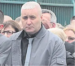  ??  ?? Loyalist Colin Horner who was shot dead in Bangor pictured at the funeral of Geordie Gilmore in Carrickfer­gus in March this year