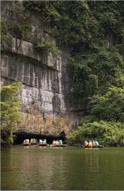  ??  ?? Right: Discover dark caves and hidden pagodas on a boat tour of Trang An.