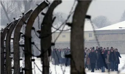  ?? Photograph: Ralf Hirschberg­er/EPA ?? Visitors at Sachsenhau­sen. Tens of thousands of prisoners died of starvation, disease and forced labour at the camp north of Berlin.