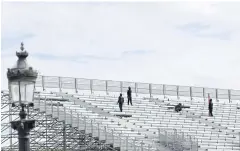  ?? REUTERS ?? Workers install the bleachers at the Parc Urbain La Concorde venue under constructi­on for the Paris 2024 Olympic and Paralympic Games at the Place de la Concorde in Paris.