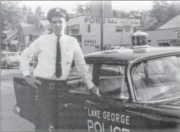  ??  ?? In this 1957 photo from “Lake George: A View from the Top,” Bob Blais makes the rounds as a new police officer in the village.