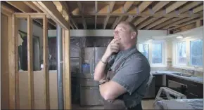  ?? Handout ?? After tearing down drywall, Mike Holmes inspects a home renovation gone wrong.