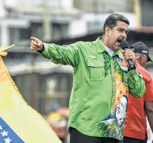  ?? CARLOS BECERRA/BLOOMBERG VIA GETTY IMAGES ?? PRESIDENT NICOLAS MADURO at a campaign rally in Caracas on May 17.