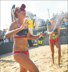  ?? Christina House Los Angeles Times ?? ALIX KLINEMAN and April Ross, left, celebrate after beating Brittany Hochevar and Kelly Claes 27-25, 17-21, 17-15 to win the Manhattan Beach Open.