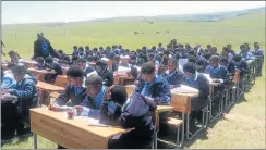  ?? Picture: SUPPLIED ?? IMAGE THAT WENT VIRAL: Grade 10 pupils from Xhentse Senior Secondary School writing their final exams in the open, unprotecte­d from the sweltering sun