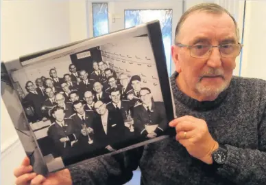  ??  ?? Ken Lewis with the photograph of GUS band he received from his family on Christmas Day