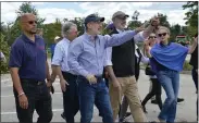  ?? RACHEL RAVINA - MEDIANEWS GROUP ?? Along with other state, county, and federal officials, Upper Dublin Township Commission­er Ira Tackel, second from left, and Gov. Tom Wolf, third from left, walk through areas in Upper Dublin Township Sept. 3 that were damaged as the remnants of Hurricane Ida moved through the region.