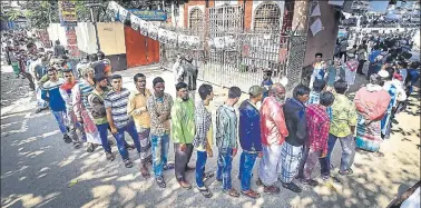  ?? AFP ?? ■ Voters wait outside a polling station in Dhaka on Sunday.