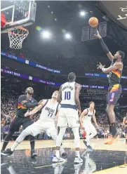  ?? AFP ?? The Suns’ Deandre Ayton, right, shoots against the Mavericks in Phoenix.