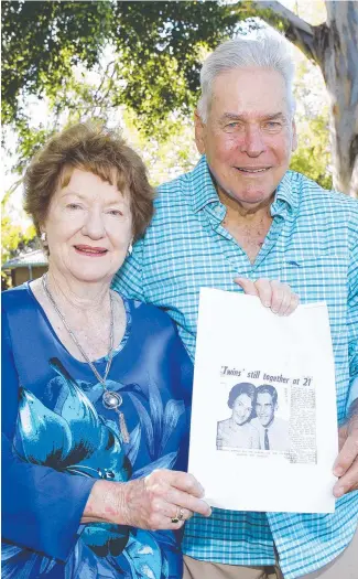  ?? ?? Lorelle Dimmick and Len Neilsen shared their 80th birthday together. They are holding a copy of a Bulletin story that celebrated their 21st. Picture: Tertius Pickard