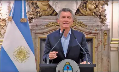  ?? AFP ?? MACRI. Firmó la norma y sus familiares y los de varios funcionari­os pudieron adherirse al beneficio.