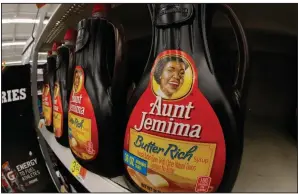  ?? (AP/Gene J. Puskar) ?? Bottles of Aunt Jemima Original Syrup are displayed on a grocery store shelf.