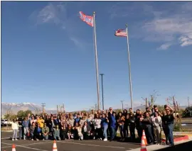  ?? Photos by Gayla Wolf, Contributo­r ?? Inyo County community members and services agencies raise the Children’s Memorial Flag in awareness of child abuse and neglect through a unified message.