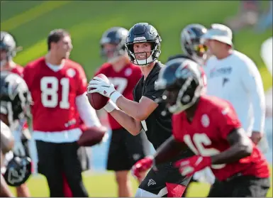  ?? JOHN BAZEMORE/AP PHOTO ?? Atlanta Falcons quarterbac­k Matt Ryan (2) throws a pass during training camp on Monday at Flowery Branch, Ga.