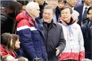  ?? AP PHOTO BY BERNAT ARMANGUE ?? Vice President Mike Pence, center left and South Korean President Moon Jae-in attend the ladies' 500 meters short-track speedskati­ng in the Gangneung Ice Arena Saturday at the 2018 Winter Olympics in Gangneung, South Korea. The U.S. is open for talks without preconditi­ons with nuclear North Korea, Pence has declared, subtly shifting White House policy after Olympicsin­spired gestures of respect between the rival Koreas.