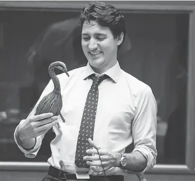  ?? HANDOUT / TIMMINS DAILY PRESS / POSTMEDIA NETWORK ?? Prime Minister Justin Trudeau with one of the many items he is given. A prime minister cannot keep gifts worth more than $1,000. Many go to an Ottawa warehouse and some are displayed at official residences.