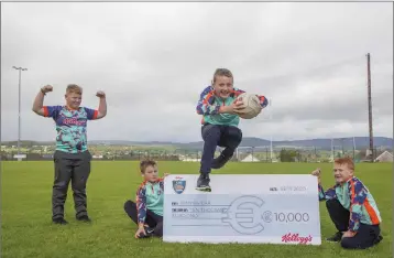  ??  ?? Rathnew GAA Club has been boosted with the news that it has won €10,000 in the 2020 Kellogg’s GAA Cúl Camps on-pack promotion. Pictured with the cheque are juvenile members Olly Quinn, Niall Dignam, Conor Dignam and Ronan Merrigan.