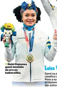  ??  ?? Neisi Dajomes ganó medalla de oro en halterofil­ia.