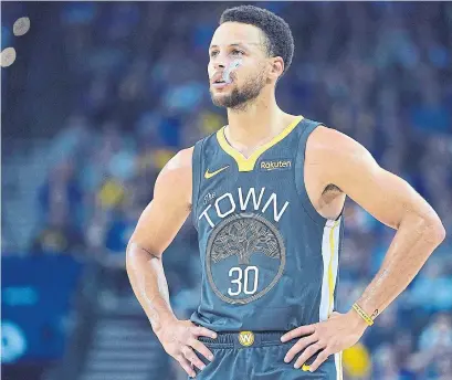  ?? THEARON W. HENDERSON GETTY IMAGES ?? The Golden State Warriors have continued to win despite a string of injuries to players, including Stephen Curry.