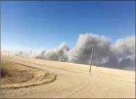  ?? SUBMITTED PHOTO KEN KUNDERT ?? Image of the devastatin­g wildfire barrelling down on the Kundert family’s cattle and lands taken on Oct. 17.