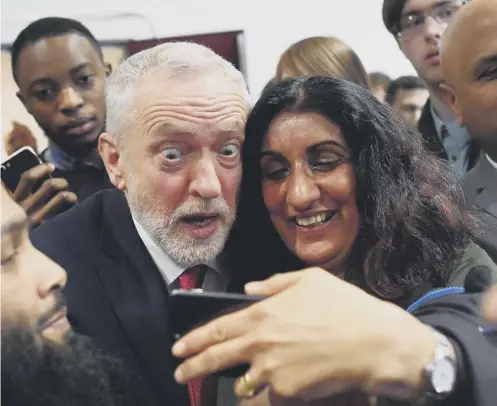  ?? PICTURE: BEN STANSALL/AFP/GETTY IMAGES ?? Jeremy Corbyn poses for selfies with the crowd after his Brexit speech at Coventry University